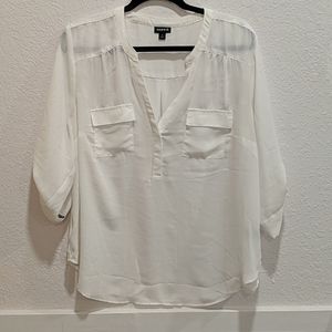 White long sleeve blouse with pockets.